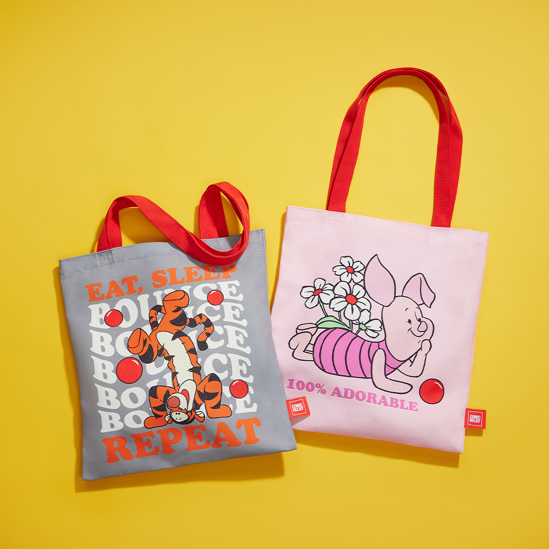 Two Winnie the Pooh–themed tote bags displayed against a bright yellow background. The grey bag features Tigger bouncing with the text “Eat, Sleep, Bounce, Repeat,” and the pink bag shows Piglet carrying a bunch of flowers with the words “100% Adorable.”